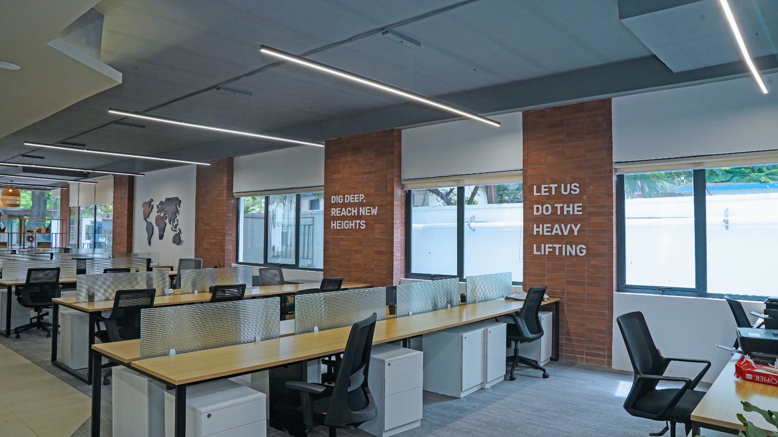Wide view of the 5,264 sq.ft. Ground Floor plate at Capstone House showing open workstations, glazing and breakout seating