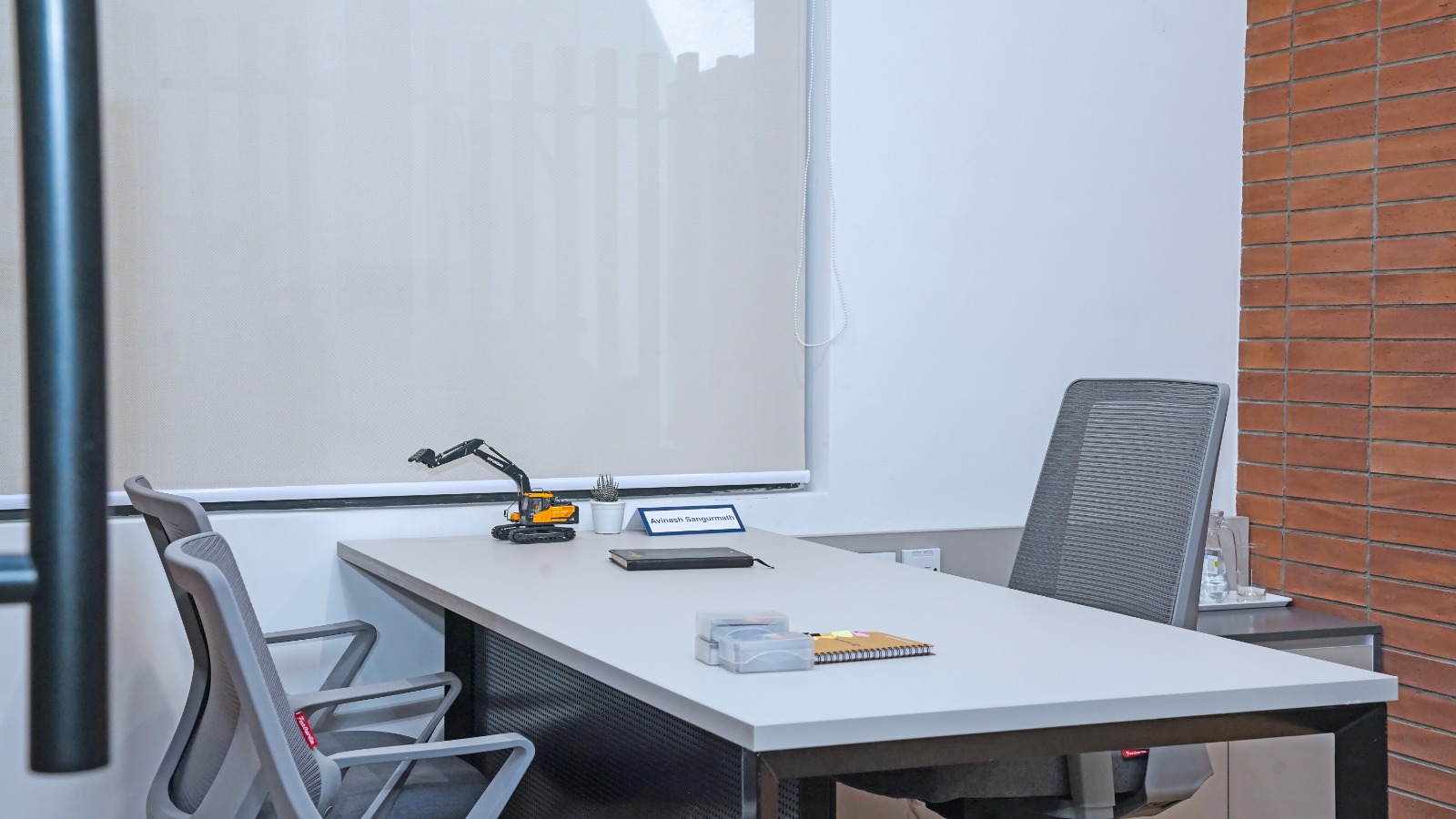 Private cabin with desk, executive chair and visitor seating in the Capstone House Grade A office space near MG Road Bangalore