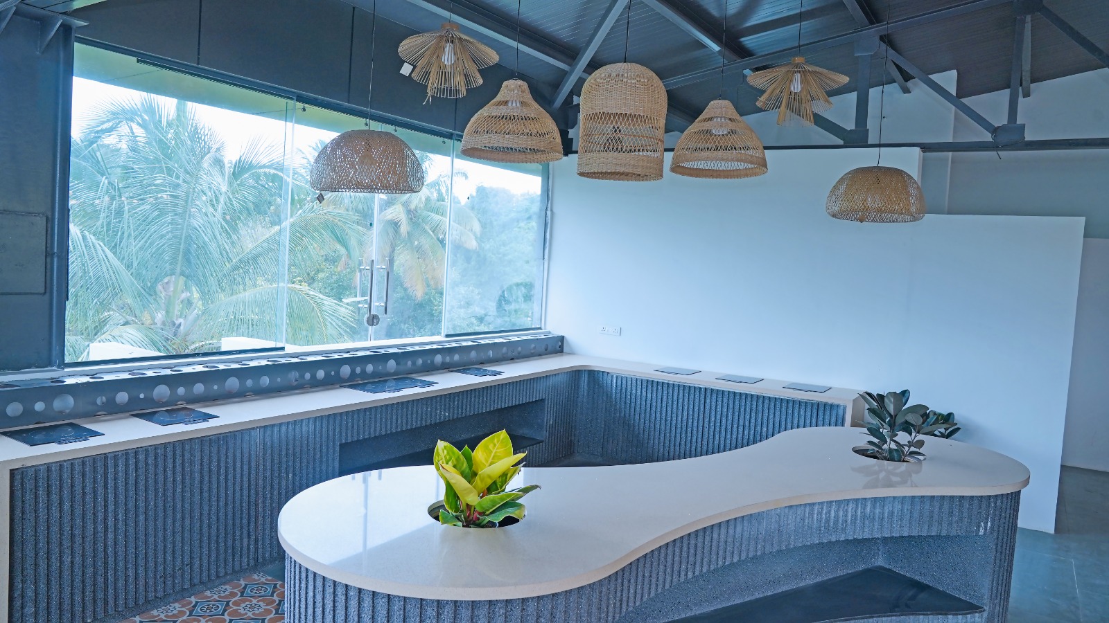Second view of the Capstone House cafeteria and pantry seating with coffee machine access for office tenants near MG Road Bangalore