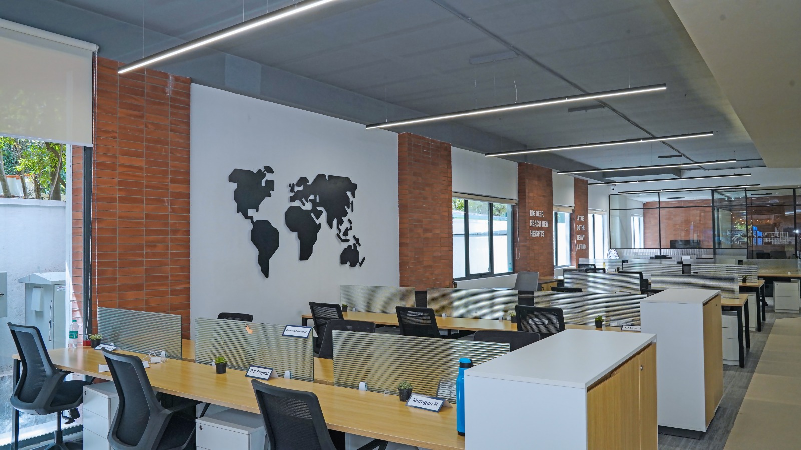 Rows of installed workstations with task chairs and pedestals in the Grade A office space at Capstone House near MG Road Bangalore